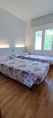 Cama o camas de una habitación en LLOGUER30 Cecilia's House the paradise