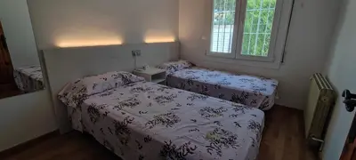 Cama o camas de una habitación en LLOGUER30 Cecilia's House the paradise