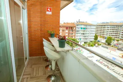 Un balcón o terraza de AL39 - Atico con barbacoa playa Fenals