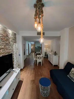 Una televisión o centro de entretenimiento en Sea you soon apartment. Lloret de Mar city center