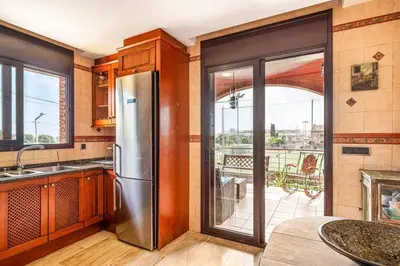 Una cocina o zona de cocina en Casa rustica con piscina y jardin