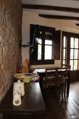 Una televisión o centro de entretenimiento en Apartaments Rurals Ai Manyac