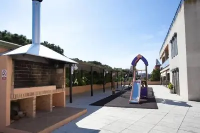 Zona de juegos infantil en Mini-apartament cèntric a Platja d'Aro