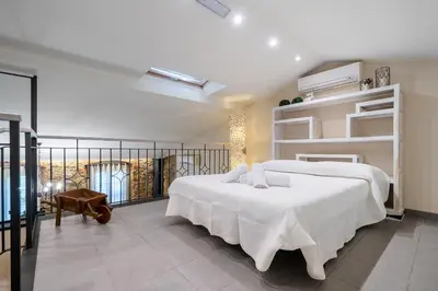 Cama o camas de una habitación en Hauzify I Casa Palou