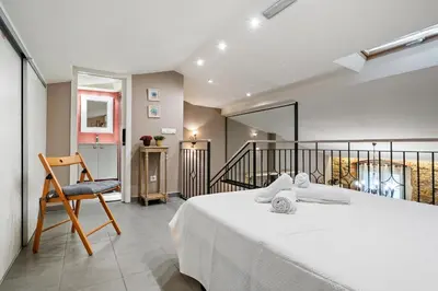 Cama o camas de una habitación en Hauzify I Casa Palou