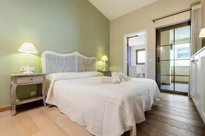 Cama o camas de una habitación en Hauzify I Casa Palou