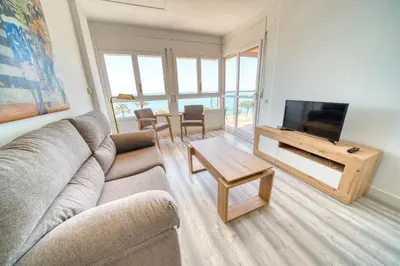 Una televisión o centro de entretenimiento en HomeHolidaysRentals Aquilone - Costa Barcelona
