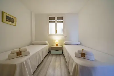 Cama o camas de una habitación en HomeHolidaysRentals Aquilone - Costa Barcelona