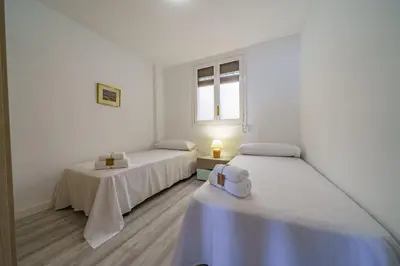 Cama o camas de una habitación en HomeHolidaysRentals Aquilone - Costa Barcelona
