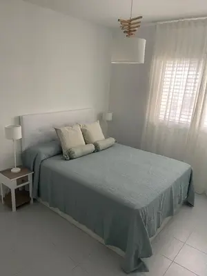 Cama o camas de una habitación en Aquamarine Sant Feliu en la playa con patio