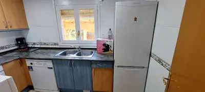 Una cocina o zona de cocina en Bravaholidays-601-Lloret Park 1