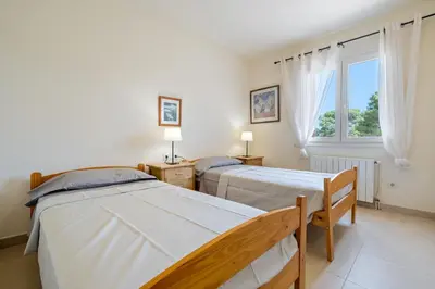 Cama o camas de una habitación en Hauzify I Casa Tamariu