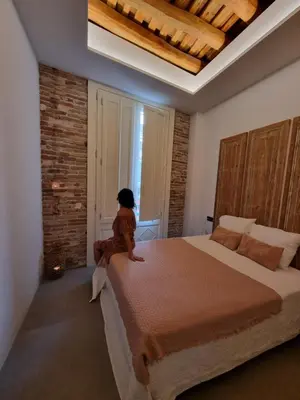 Cama o camas de una habitación en Antiquari de Blanes Apartamento Boutique en la Costa Brava