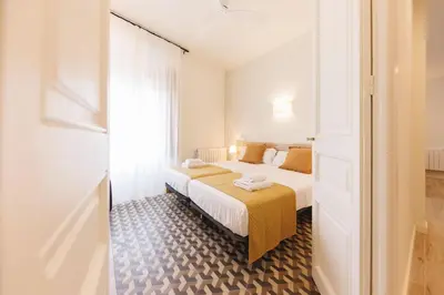 Cama o camas de una habitación en Bravissimo Ciutadans Penthouse, 3-bedroom apartment