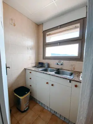 Una cocina o zona de cocina en Apartamento en Torre Valentina con vista al mar