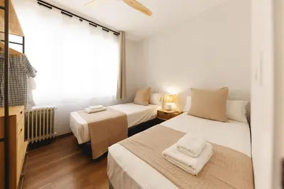 Cama o camas de una habitación en Bravissimo Figuerola, Spacious 3-bedroom apartment