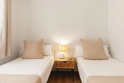 Cama o camas de una habitación en Bravissimo Figuerola, Spacious 3-bedroom apartment