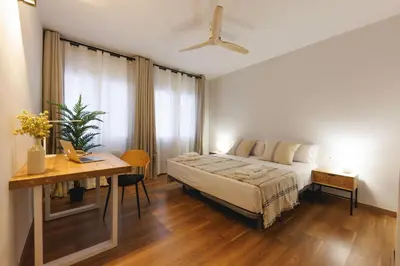 Cama o camas de una habitación en Bravissimo Figuerola, Spacious 3-bedroom apartment