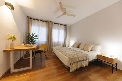Cama o camas de una habitación en Bravissimo Figuerola, Spacious 3-bedroom apartment