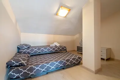 Cama o camas de una habitación en Hauzify I Apartament Ponent