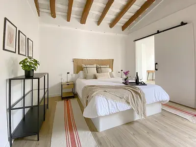 Cama o camas de una habitación en Historic House at Can Quintana by Casa de Elena