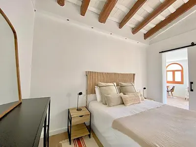 Cama o camas de una habitación en Historic House at Can Quintana by Casa de Elena