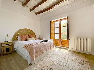 Cama o camas de una habitación en Historic House at Can Quintana by Casa de Elena