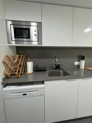 Una cocina o zona de cocina en Nuevo, espacioso y confortable con pkg y piscina
