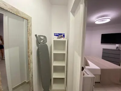 Una televisión o centro de entretenimiento en APARTAMENTS L’ARC