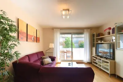 Una televisión o centro de entretenimiento en LETS HOLIDAYS Beautiful apartment with pool Tossa 2