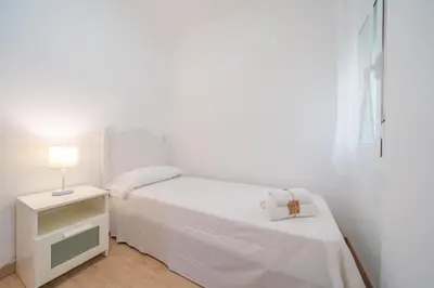 Cama o camas de una habitación en HomeHolidaysRentals Estrella - Costa Barcelona