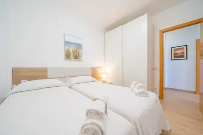 Cama o camas de una habitación en HomeHolidaysRentals Estrella - Costa Barcelona
