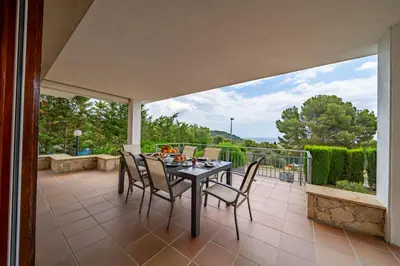 Un balcón o terraza de Villa Santa Cristina Primera Línea Playa Piscina Barbacoa Aire Acondicionado