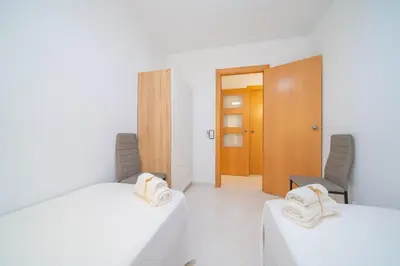 Cama o camas de una habitación en HomeHolidaysRentals Caliz - Costa Barcelona
