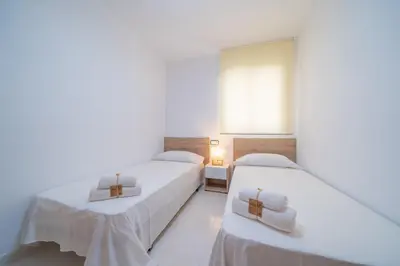 Cama o camas de una habitación en HomeHolidaysRentals Caliz - Costa Barcelona