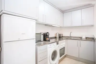 Una cocina o zona de cocina en AL38 elegant apartment in Fenals beach