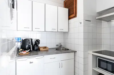 Una cocina o zona de cocina en Primera linea Sant Antoni