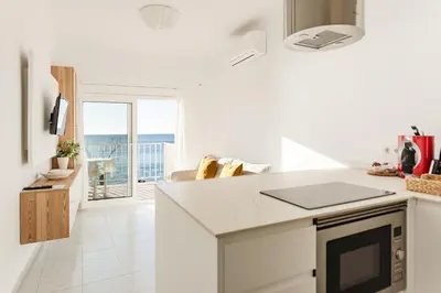 Una cocina o zona de cocina en Primera linea Sant Antoni