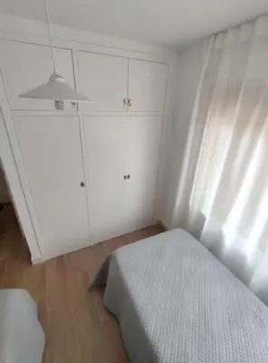 Cama o camas de una habitación en Amplio apartamento con piscina al lado de la playa