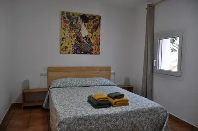 Cama o camas de una habitación en Acogedor apartamento en entorno rural
