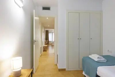 Cama o camas de una habitación en Bravissimo Plaça Catalunya, 2-bedroom apartment with terrace