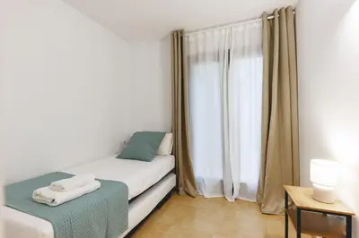 Cama o camas de una habitación en Bravissimo Plaça Catalunya, 2-bedroom apartment with terrace