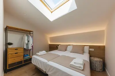 Cama o camas de una habitación en Bravissimo Cort Reial Duplex, Spacious with 3 bedrooms