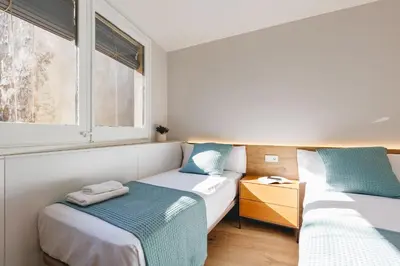 Cama o camas de una habitación en Bravissimo Cort Reial Duplex, Spacious with 3 bedrooms