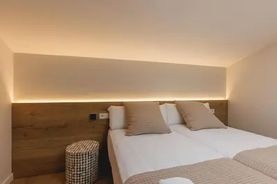 Cama o camas de una habitación en Bravissimo Cort Reial Duplex, Spacious with 3 bedrooms