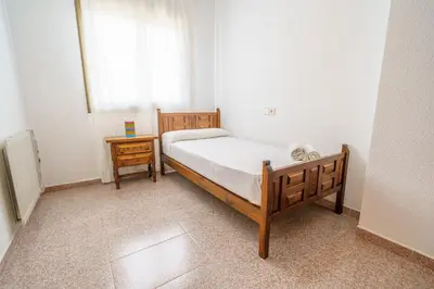 Cama o camas de una habitación en HomeHolidaysRentals Anglada - Costa Barcelona