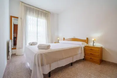 Cama o camas de una habitación en HomeHolidaysRentals Anglada - Costa Barcelona