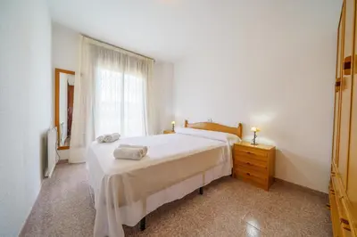 Cama o camas de una habitación en HomeHolidaysRentals Anglada - Costa Barcelona