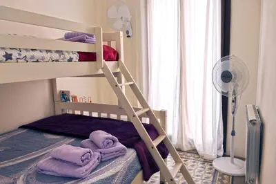 Cama o camas de una habitación en La LLar de la Kim, Bonita casa a 150m del mar y 40km de Barcelona