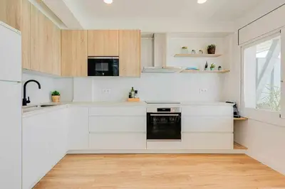 Una cocina o zona de cocina en BA - Primera Linea - Neptuno